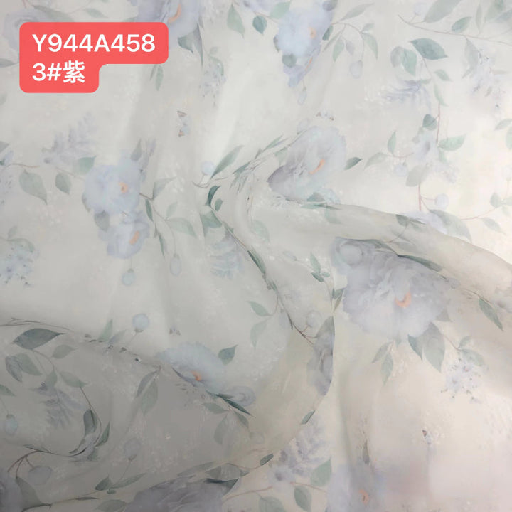 Custom purple for romantic floral maternity photoshoot dress styled for editorial pregnancy photography with soft organza flowers