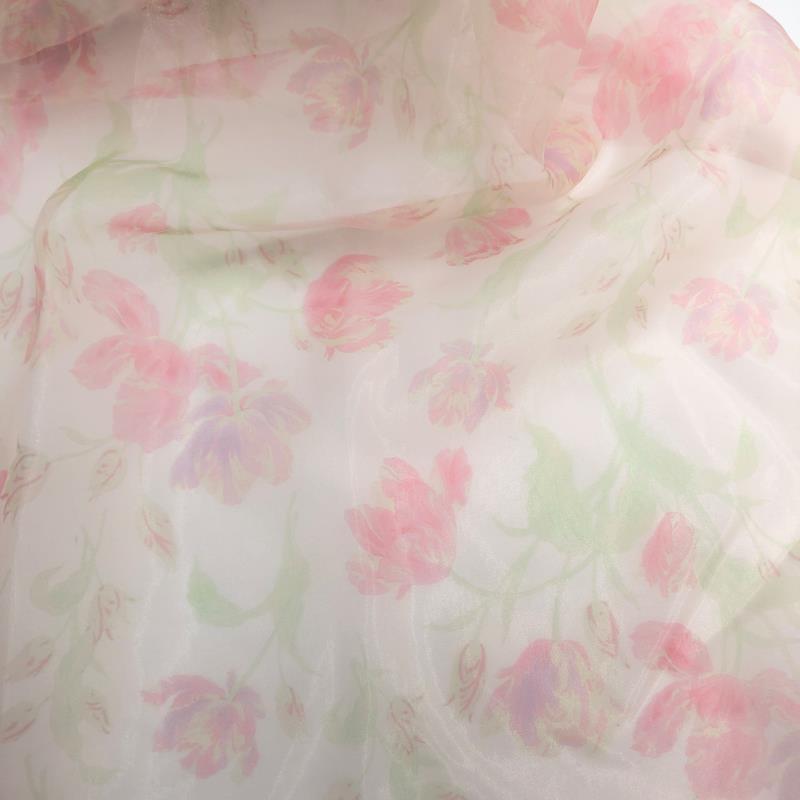 Custom color pink of romantic floral maternity photoshoot dress styled for editorial pregnancy photography with soft organza flowers