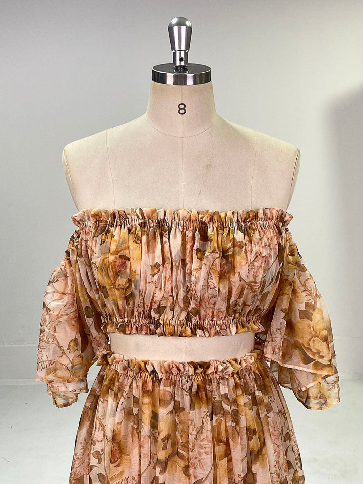 Close-up of chiffon floral print detail on photoshoot dress showing soft elegant fabric texture and pattern