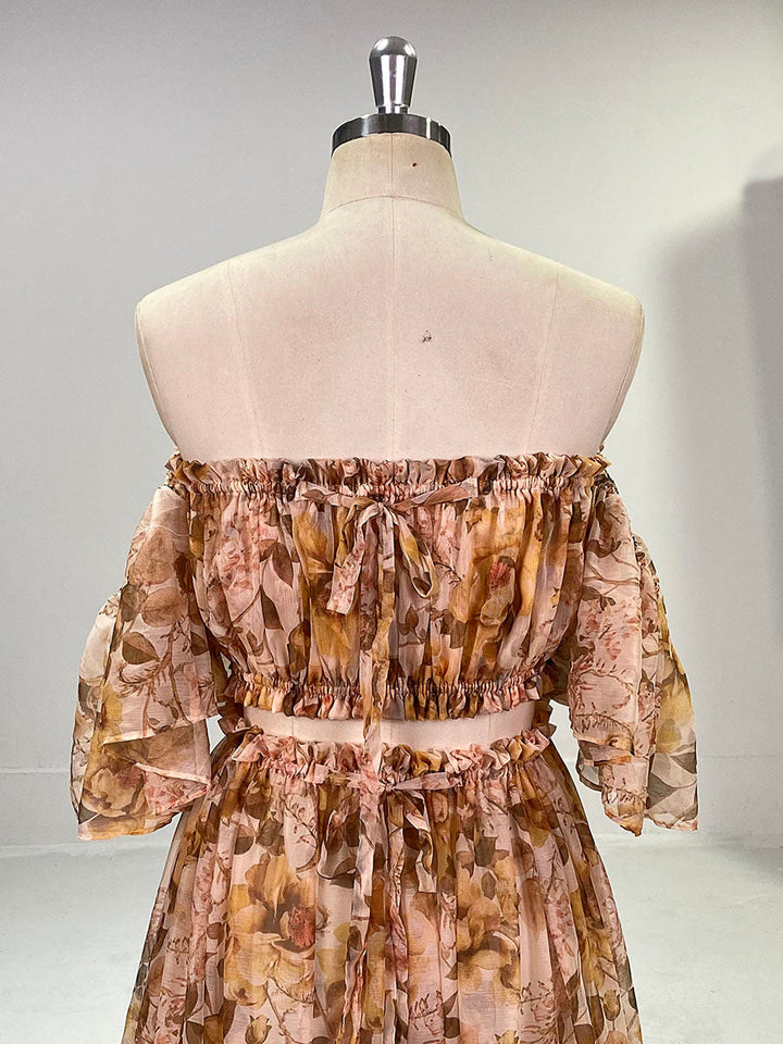 Close-up of chiffon floral print detail on photoshoot dress showing soft elegant fabric texture and pattern