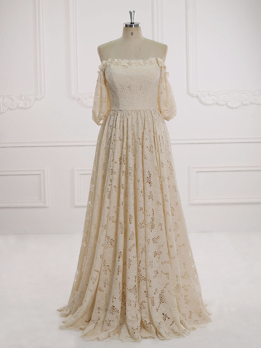 Full front view of an elegant ivory half sleeve off shoulder lace wedding dress displayed on a mannequin.