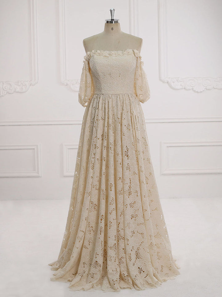 Full front view of an elegant ivory half sleeve off shoulder lace wedding dress displayed on a mannequin.