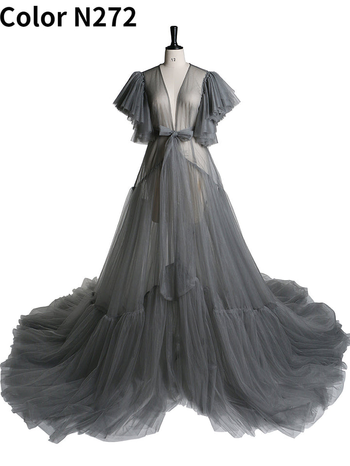 Front view of grey maternity dress for photo shoot featuring V-neck design, bow detail, and short sleeves