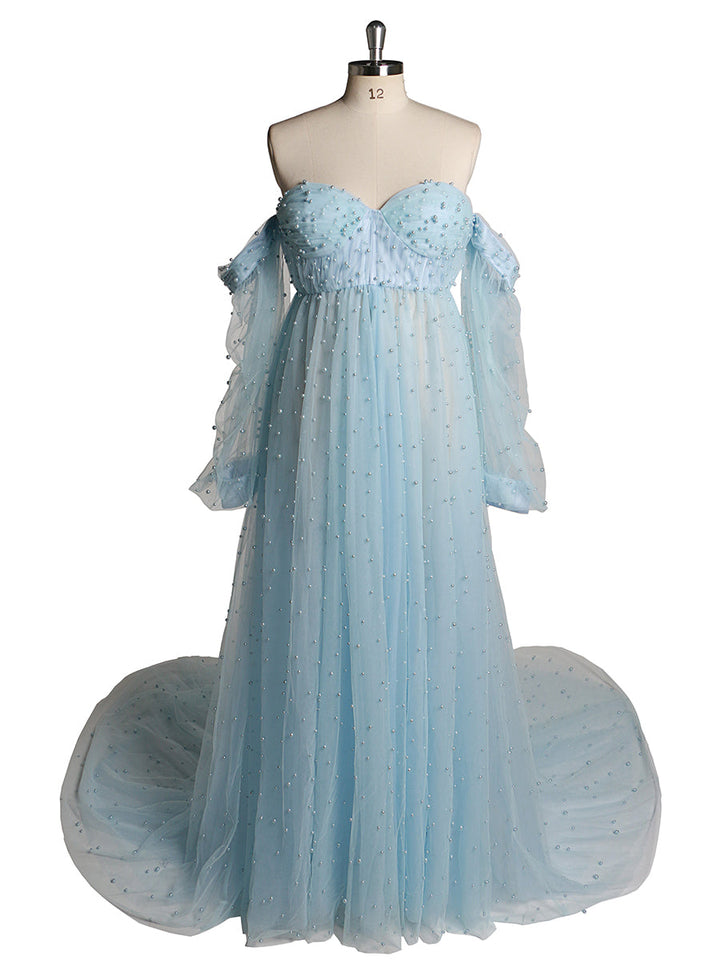 Front view of blue maternity photoshoot gown with open front design and elegant pearl detailing