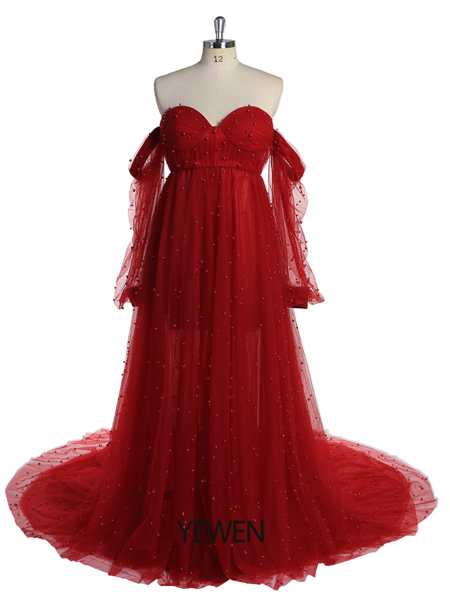 Front view of dark red maternity photoshoot gown with open front design and elegant pearl detailing