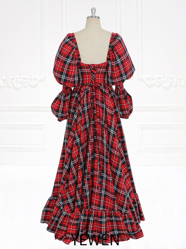 Close-up back detail of maxi dress highlighting plaid pattern and elegant holiday dress design
