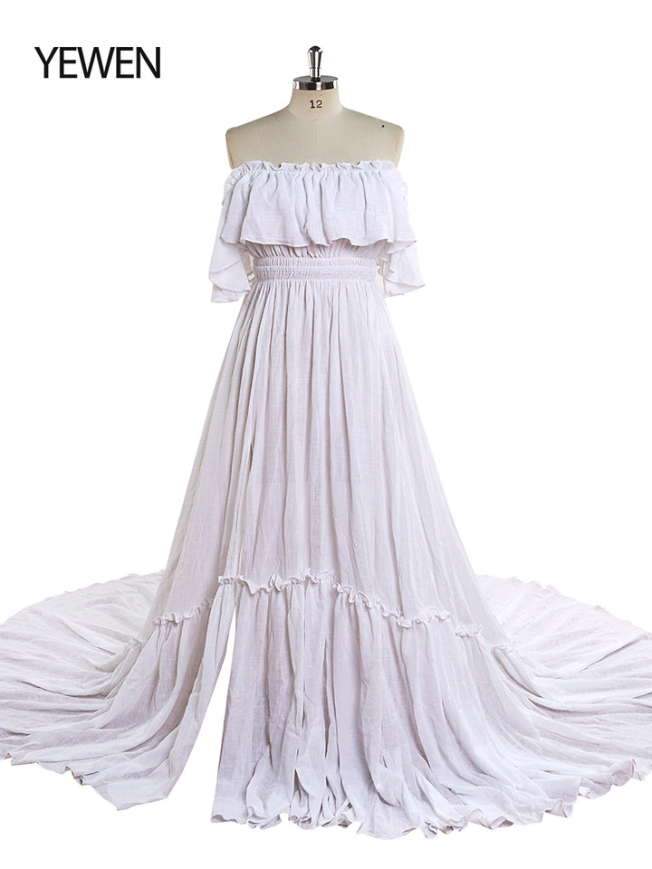 Front view of white off shoulder maternity dress for photo shoot with adjustable waist and elegant maxi silhouette