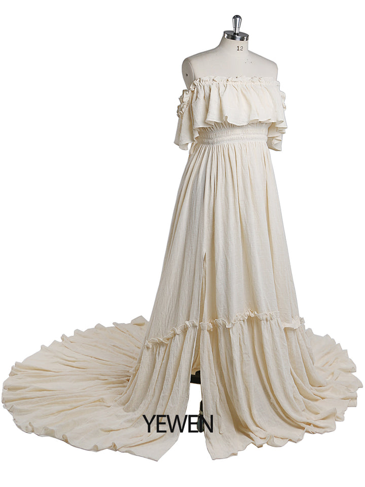 Side view of off shoulder maternity dress for photo shoot showing flowing maxi gown and adjustable waist design