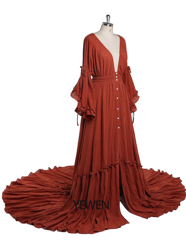Side view of rust photography dress showing flowing evening gown silhouette for maternity photoshoot