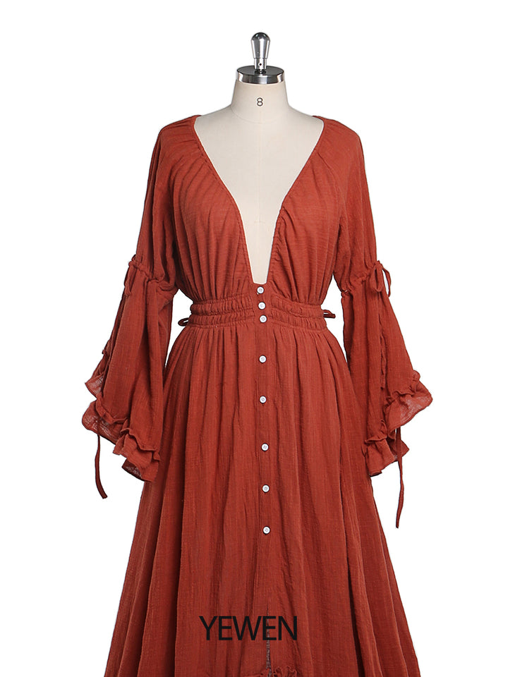 Close-up of V neck detail on photography dress showing elegant fabric and maternity design