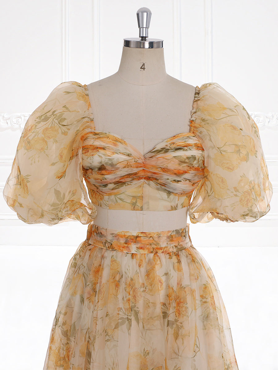 Close-up front detail of photoshoot dress showing floral pattern and delicate fabric craftsmanship