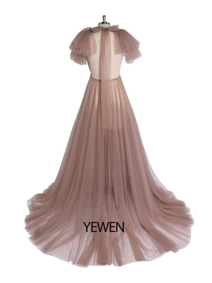 Back view of pink maternity dress for photo shoot with tulle flowers and long flowing silhouette