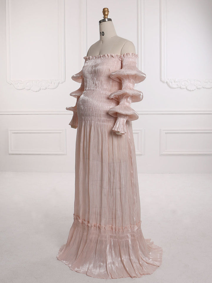 Side view of pleated maternity dress showing elegant folds and flattering pregnancy gown silhouette