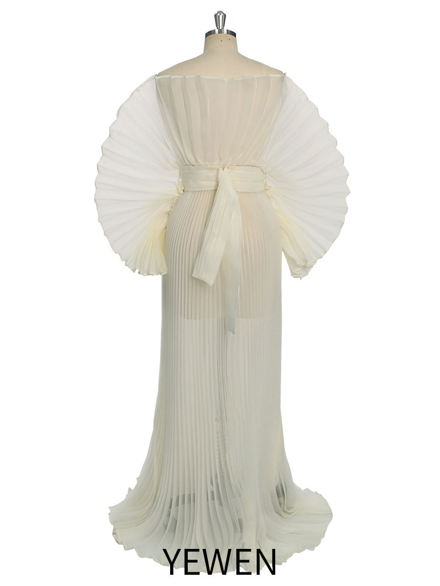 Back view of pleated maternity photoshoot dress made with organza fabric for elegant photoshoot styling