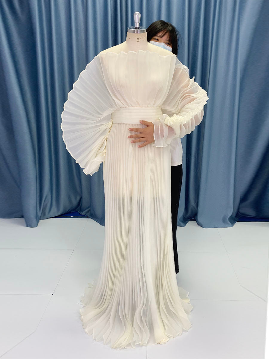 Full body view of pleated maternity photoshoot dress designed with organza fabric for elegant photography sessions