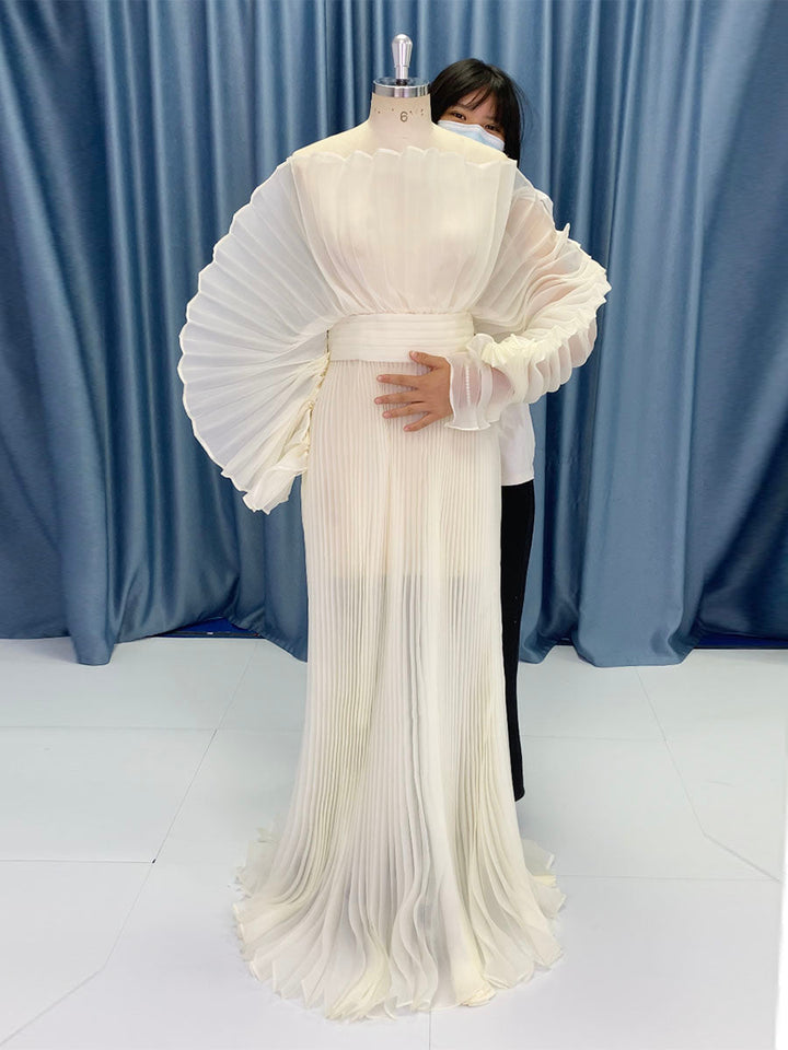 Full body view of pleated maternity photoshoot dress designed with organza fabric for elegant photography sessions