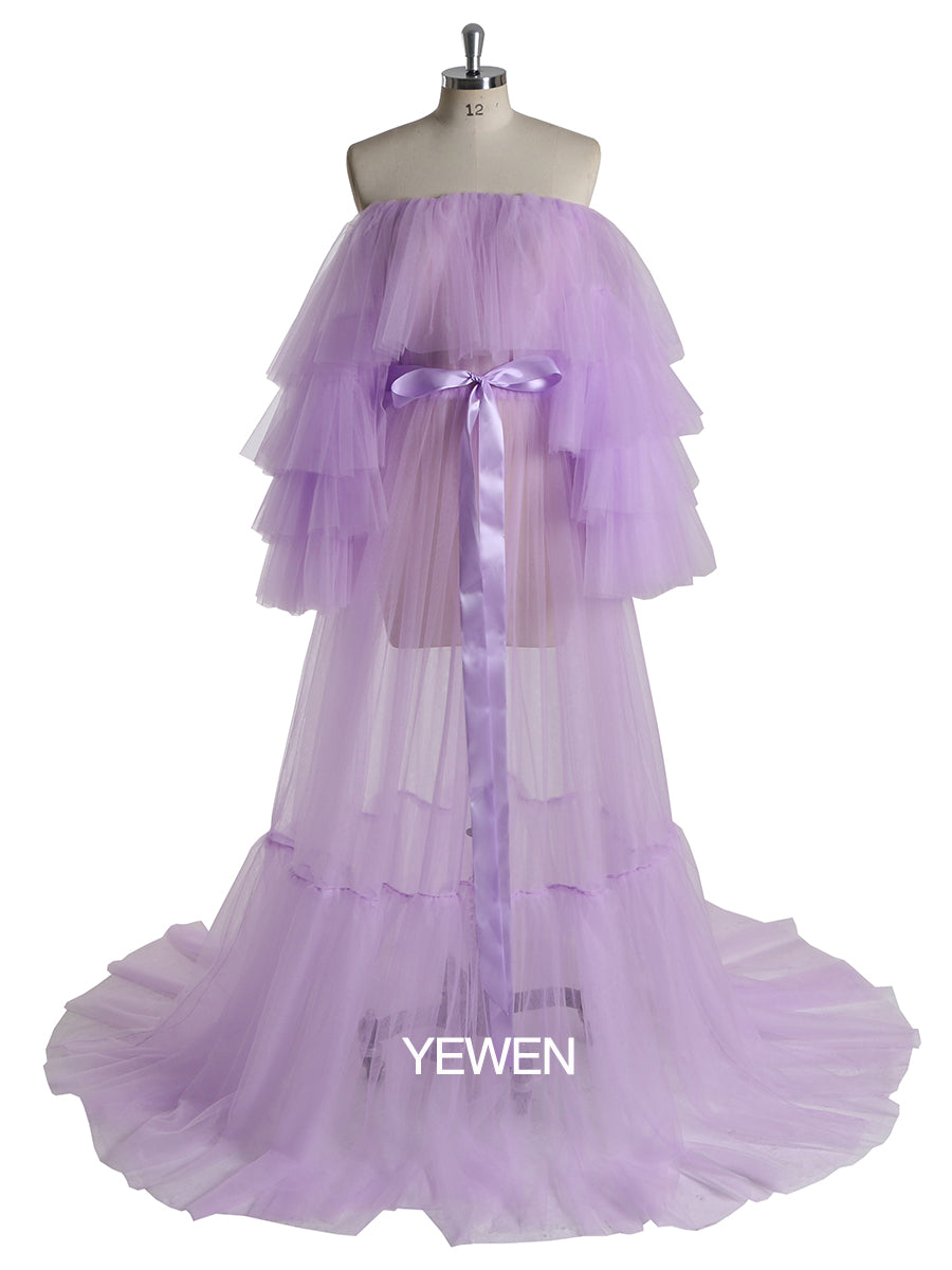 Front view of purple plus size maternity photoshoot dress featuring off shoulder ruffled design and flowing maxi silhouette