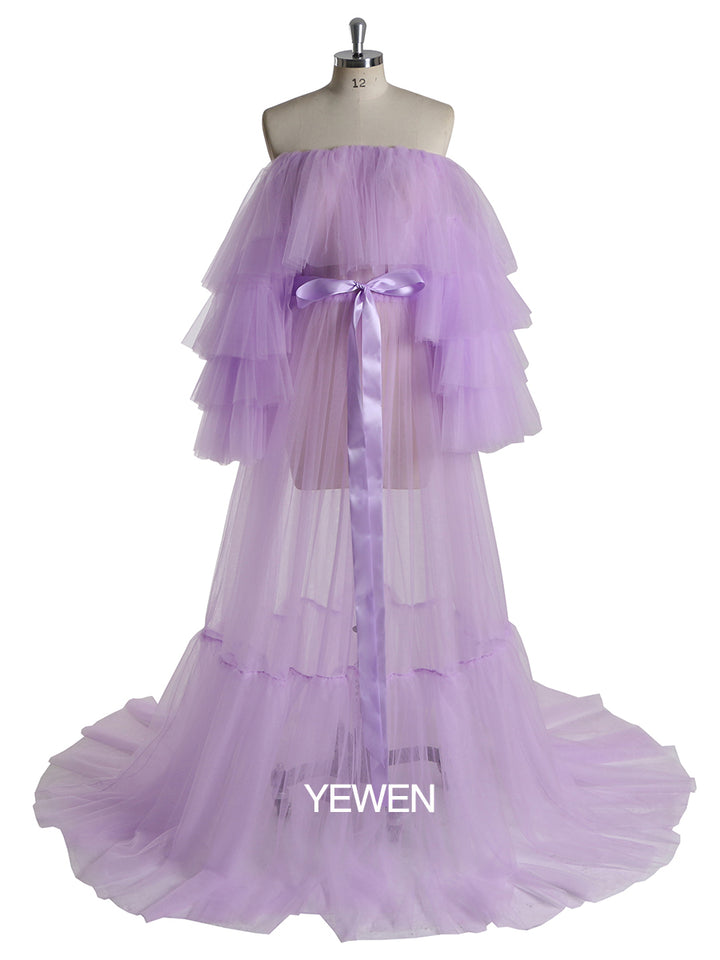 Front view of purple plus size maternity photoshoot dress featuring off shoulder ruffled design and flowing maxi silhouette