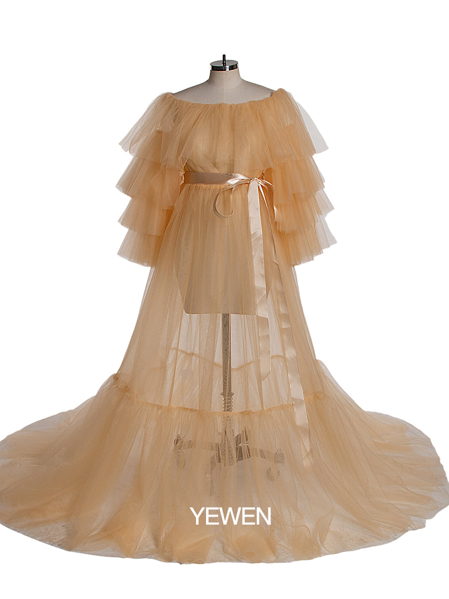 Front view of yellow plus size maternity photoshoot dress featuring off shoulder ruffled design and flowing maxi silhouette