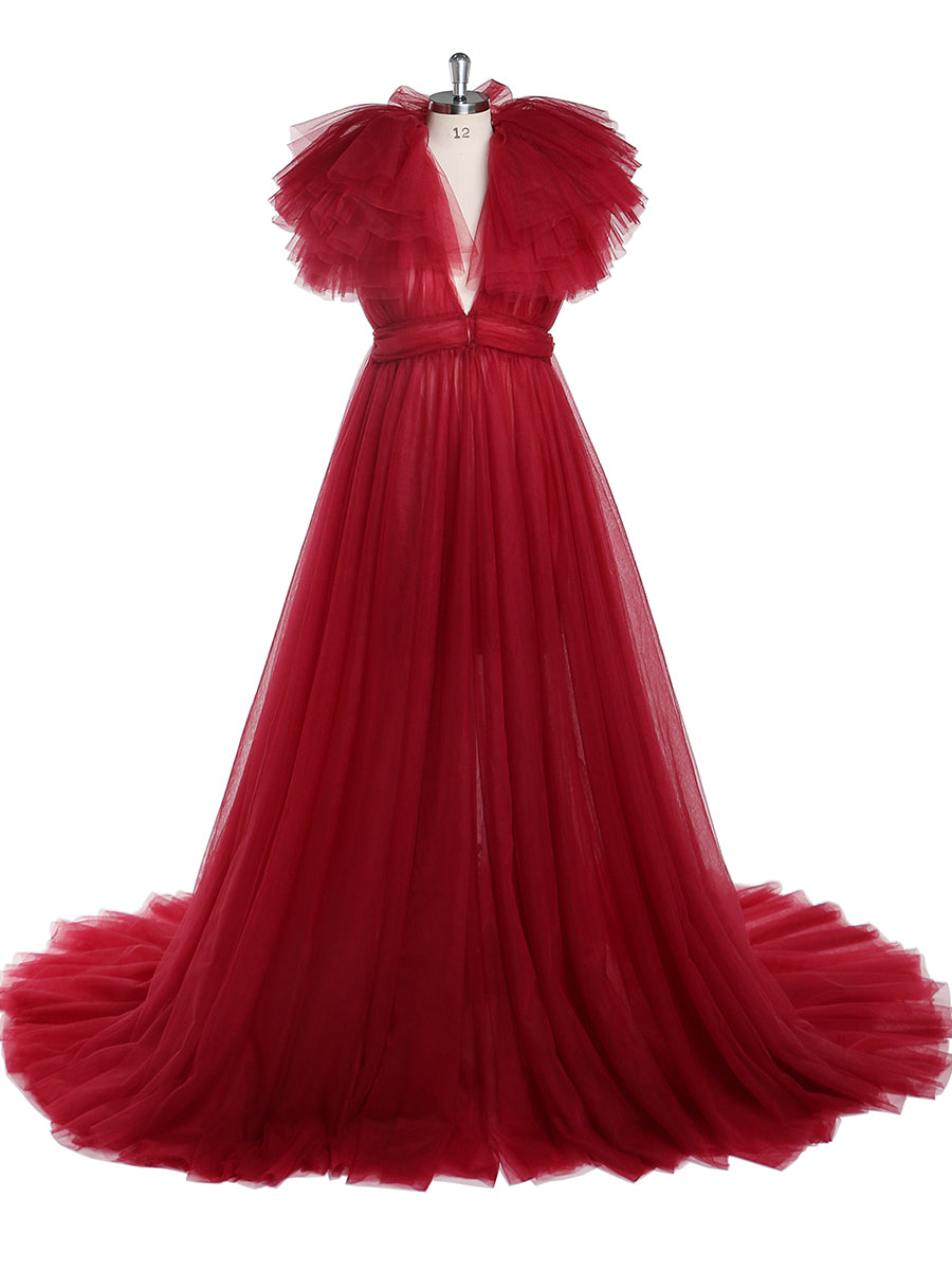 Front view of red maternity dress for photo shoot featuring tulle flowers and elegant flowing maxi design
