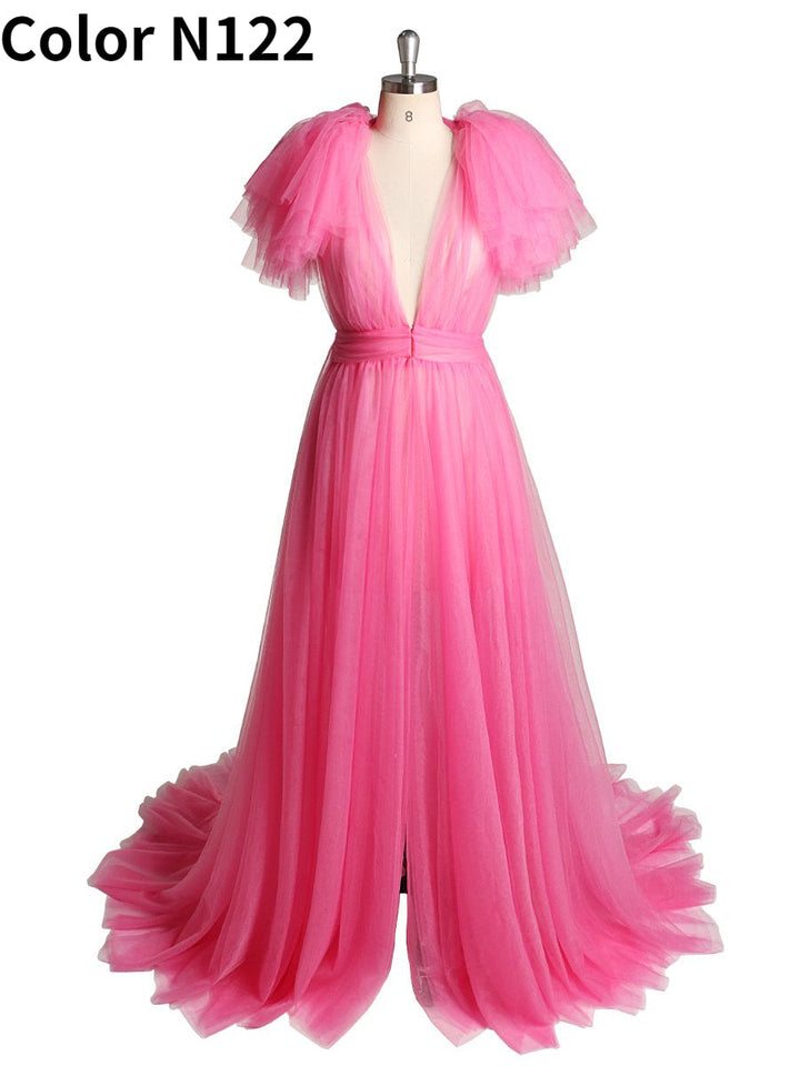 Front view of rose red maternity dress for photo shoot featuring tulle flowers and elegant flowing maxi design
