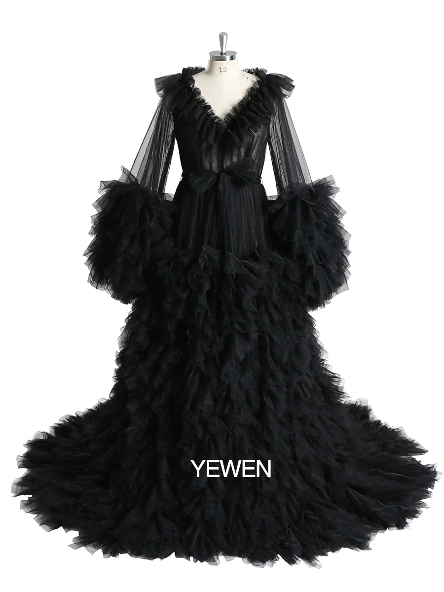 Front view of ruffled maternity dress for photo shoot featuring black color, V-neck design, and elegant silhouette