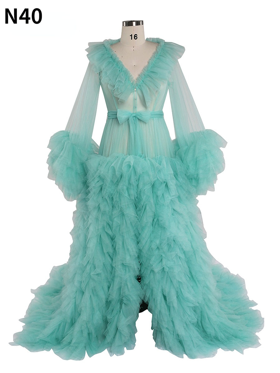 Front view of ruffled maternity dress for photo shoot featuring green color, V-neck design, and elegant silhouette