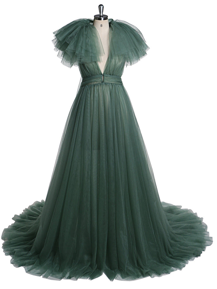 Front view of sapphire maternity dress for photo shoot featuring tulle flowers and elegant flowing maxi design