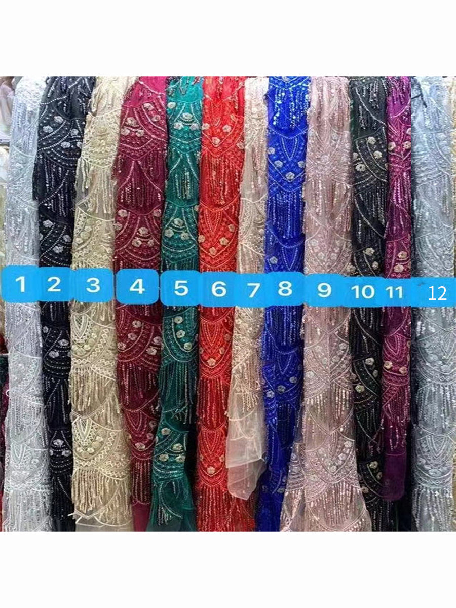 Custom colors of sparkling sequin detail on maternity dress for photo shoot showing glamorous reflective texture