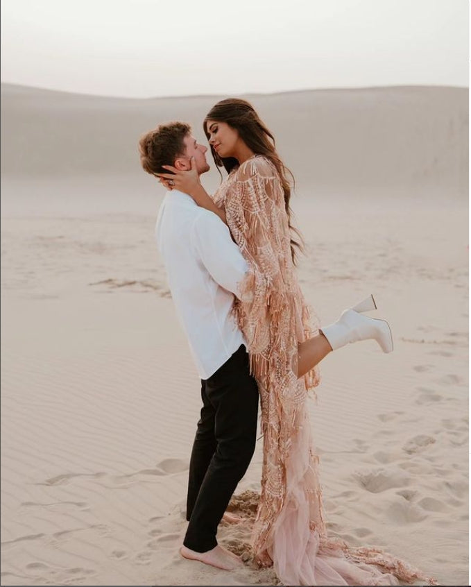 Elegant sequin maternity dress styled in soft light for glamorous pregnancy and baby shower photography