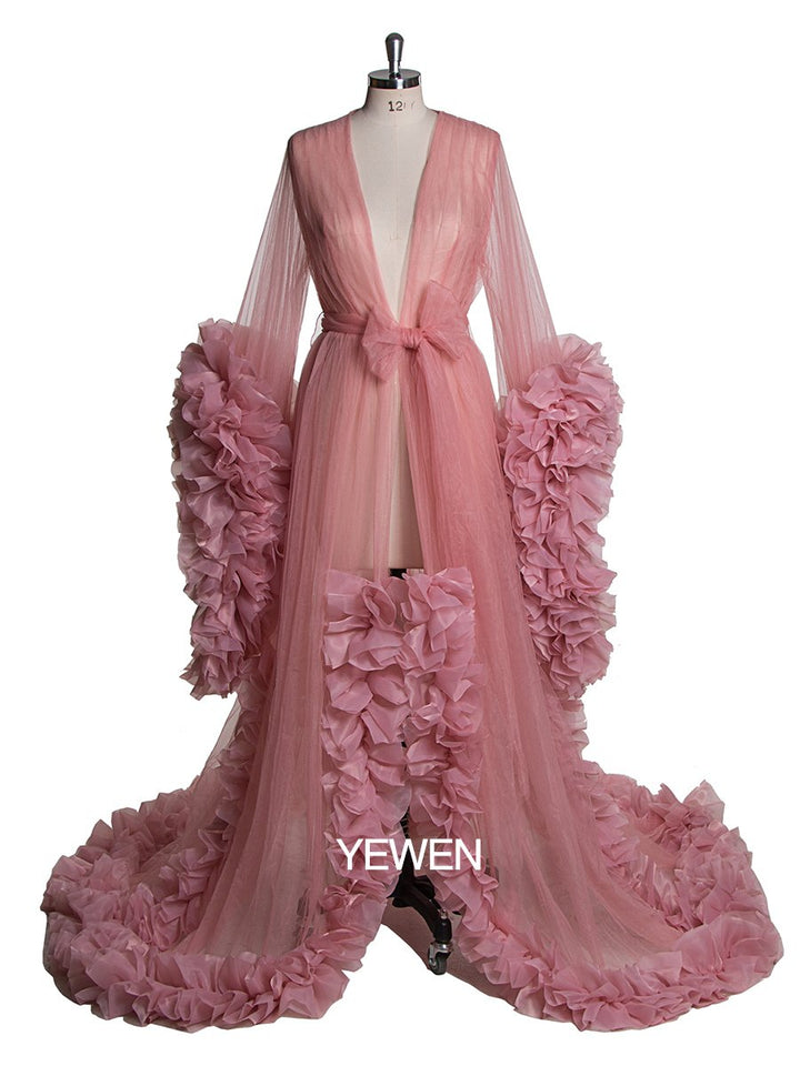 Full body view of sexy pink photoshoot dress with V-neck long sleeves and ruffled silhouette