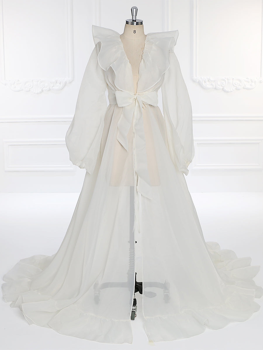 Front view of silk organza maternity dress for photo shoot featuring puffy sleeves and flowing elegant silhouette