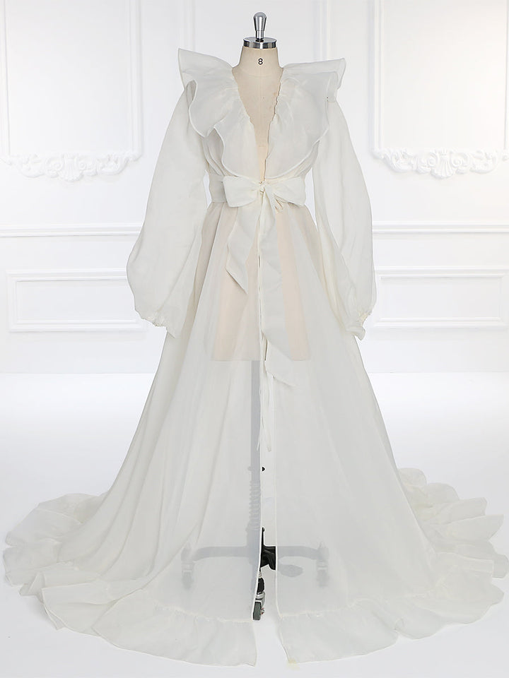 Front view of silk organza maternity dress for photo shoot featuring puffy sleeves and flowing elegant silhouette