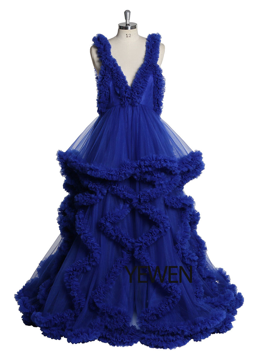 Front view of blue sleeveless maternity dress for photoshoot featuring elegant ruffle design and flowing silhouette