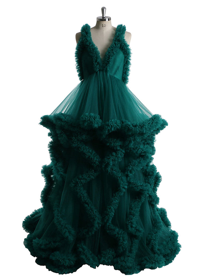 Front view of green sleeveless maternity dress for photoshoot featuring elegant ruffle design and flowing silhouette