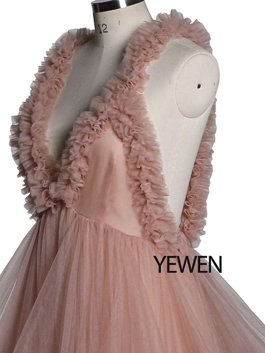 Close-up of ruffle detailing on sleeveless maternity dress for photoshoot showing soft elegant texture