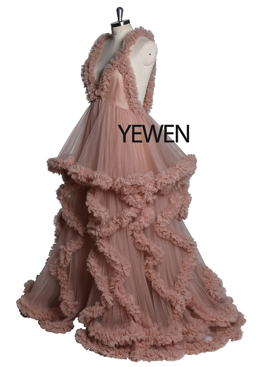 Side view of pink sleeveless maternity dress for photoshoot showing soft ruffle movement and elegant pregnancy silhouette
