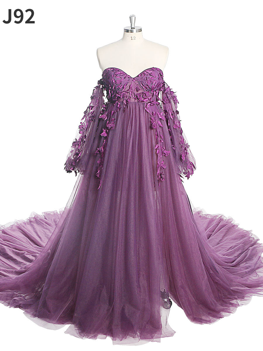 Full body view of purple tulle maternity photoshoot dress with long sleeves and floral lace design for elegant photography