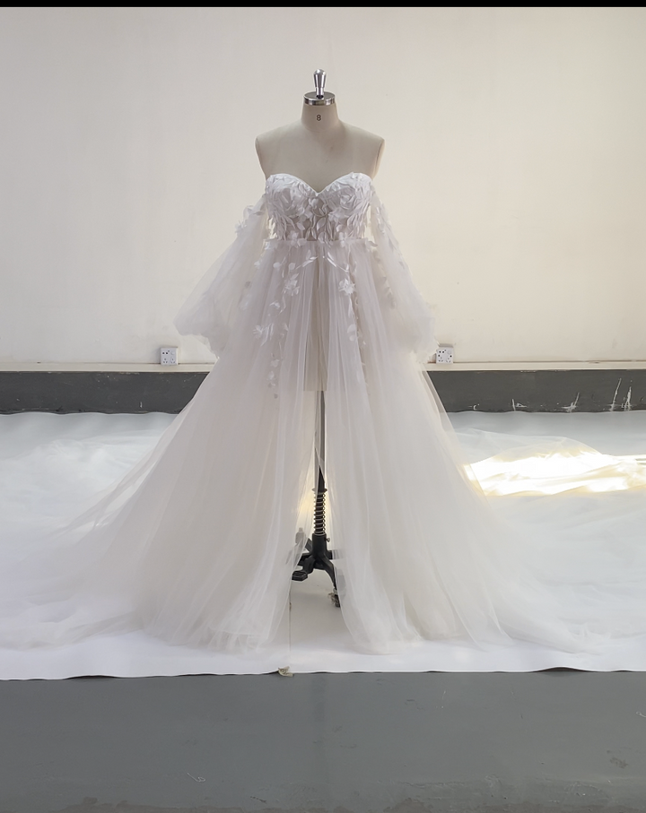 Full body view of tulle maternity photoshoot dress with long sleeves and floral lace design for elegant photography