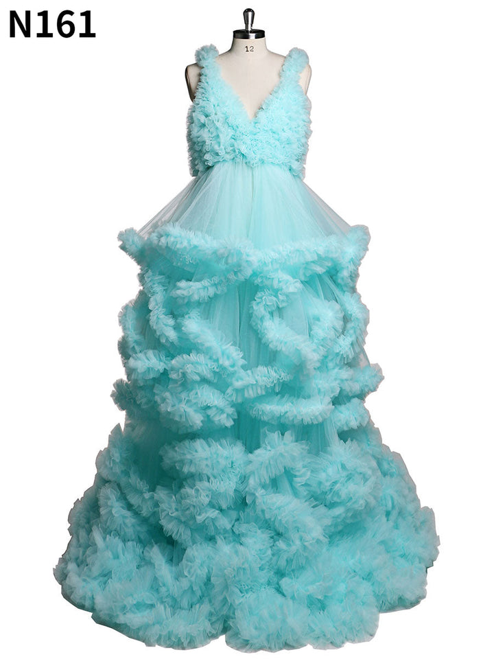 Backless green tulle photoshoot dress with elegant ruffle layers designed for maternity photography