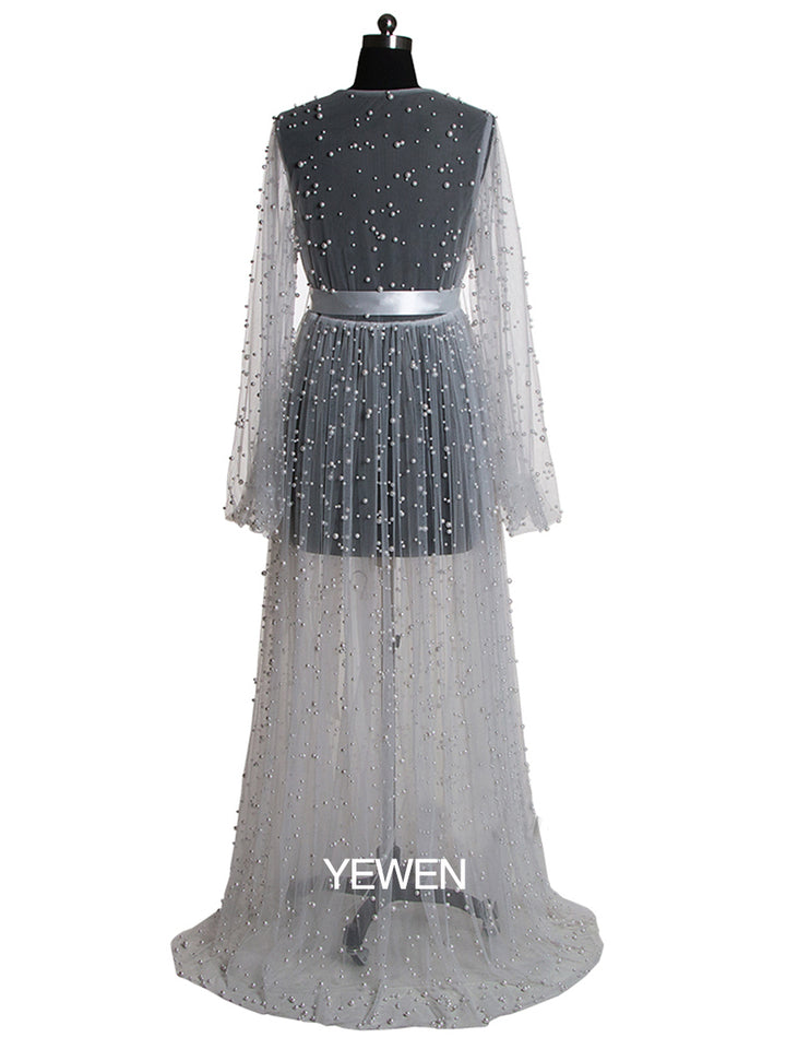 Back view of white maternity photoshoot dress with elegant silhouette and pearl detailing